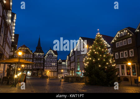 FRITZLAR, GERMANY: 25th December 2017: The marketplace of Fritzlar with Christmas tree and fairy lights during blue hour Stock Photo