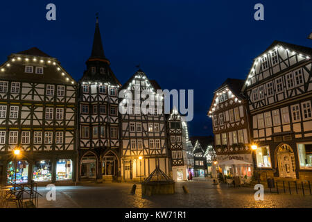 FRITZLAR, GERMANY: 25th December 2017: The marketplace of Fritzlar with fountain and fairy lights during blue hour Stock Photo