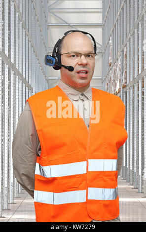 Pick by Voice Control Headset Man in Warehouse Stock Photo