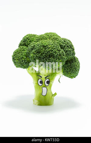 Closeup of fresh green broccoli with scared cartoon style face on white background Stock Photo