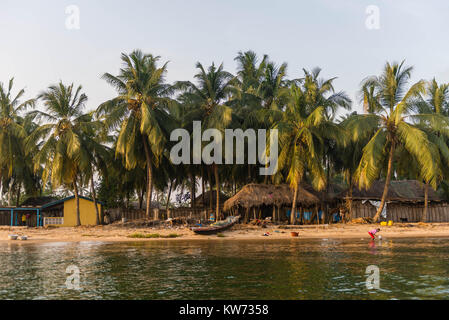 In the village of Ada Foah people live very close to the riverside, Volta River, Ada Foah, Greater Accra Region, Ghana, Africa Stock Photo