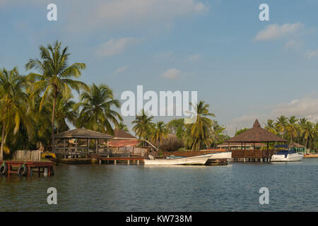 Private homes on the shore of the Volta River, Ada Foah, Greater Accra Region, Ghana, Africa Stock Photo