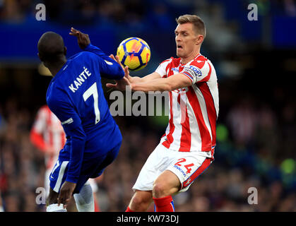 Chelsea's N'Golo Kante and Stoke City's Darren Fletcher (right) battle for the ball during the Premier League match at Stamford Bridge, London. Stock Photo