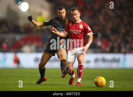 Wolverhampton Wanderers' Romain Saiss (left) and Bristol City's Joe Bryan battle for the ball during the Sky Bet Championship match at Ashton Gate, Bristol. Stock Photo