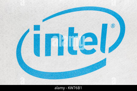 Intel logo printed on cloth and placed on white background. Intel is one of the world's largest and highest valued semiconductor chip makers Stock Photo