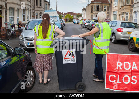 A road is closed off by volunteers as children play out in the streets as part of the Bristol based 'Playing Out' project. Stock Photo