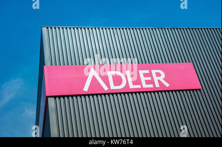 Adler Fashion Logo. Adler Fashion AG is located in Haibach near Aschaffenburg, is a listed retailer chain with 174 stores in Germany, Austria Stock Photo