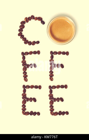 Top view of word coffee made from coffee beans and glass cup of hot coffee Stock Photo