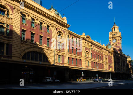 Flinders Street railway station viewed from opposite of Flinders Street. Stock Photo
