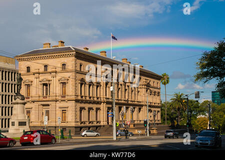 A rainbow behind the Parliament House of Victoria, Melbourne, Australia. Stock Photo