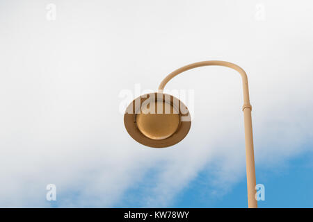 Round streetlight with blue sky and white clouds background Stock Photo