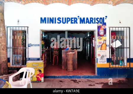 Two travelers making a purchase in a local mini-market, San Pancho, Mexico Stock Photo