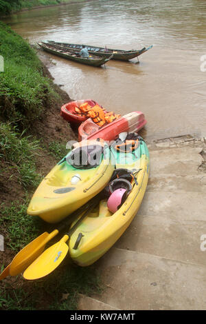 Kayaks on the steps near river near Luang Prabang in Laos Stock Photo