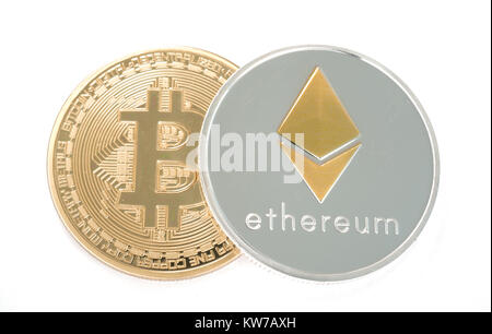 Real coin of cryptocurrency Silver Ethereum and golden bitcoinisolated on white background Stock Photo