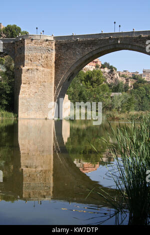 Reflection of San Martin's Bridge in Toledo, Spain in the Tagus river Stock Photo