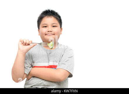 obese fat boy with broccoli on hand isolated on white background, healthy food concept and copy space Stock Photo