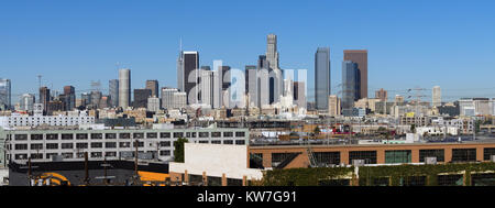 Warehouses and industrial buildings dominate the foreground of this urban view in Los Angeles Stock Photo