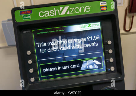 A CashZone ATM in a motorway service station warns that there is a £1.99 charge for cash withdrawals by debit card. Stock Photo