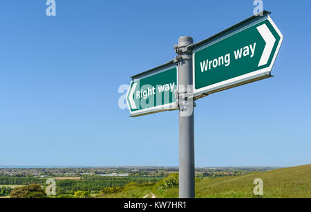 Right way or wrong way concept sign. Right or wrong direction signpost. Stock Photo