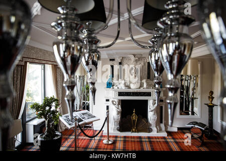 Cozy room with fireplace and mirror chandelier. Stock Photo