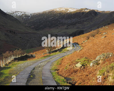 Greenside Road in winter, a little used single track winding road  leading from Glenridding to the old disused lead mines in Cumbria, England, UK Stock Photo