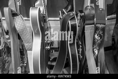 black and white detail image of a group of electric guitars Stock Photo