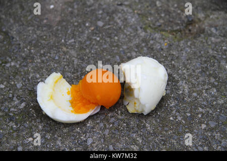 Hard boiled egg on the street Stock Photo