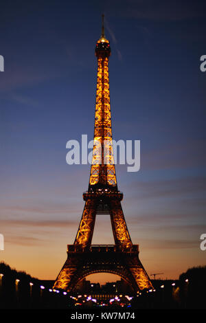Paris,France - October 4 2017 : Eiffel Tower light and beam show at dusk .Eiffel is the most famous monument of Paris, France .