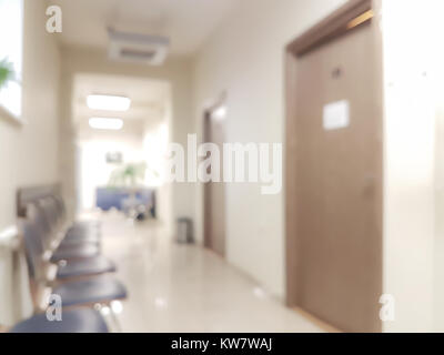 Blurred background waiting room in the doctor's office - chairs in the hallway and the door to the doctor's office Stock Photo