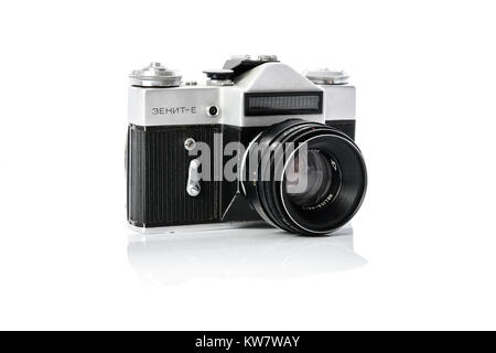 Krynica, Poland - December 29, 2017: Legendary Soviet 35 mm SLR camera Zenit-E with Helios 44mm lens isolated on white background in close-up. Stock Photo