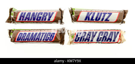 Winneconne, WI - 19 November 2017: Snicker candy bars with different names on them, such as hangry, klutz, gramaticgo and gray gray on an isolated bac Stock Photo