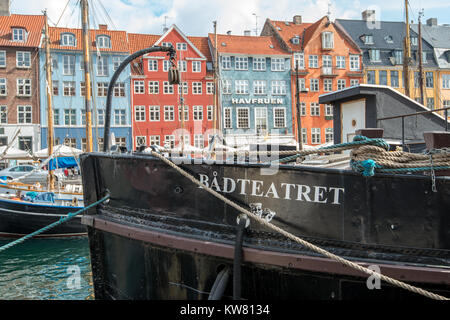 Boat theater at Nyhavn, a 17th century harbor district in Copenhagen and a popular waterfront tourist attraction and entertainment district. Stock Photo