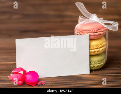 macarons cake tied  ribbon, red fuchsia flower and empty blank, St. Valentines day concept Stock Photo