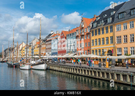 Nyhavn, a 17th century harbor district in the center of Copenhagen and currently a popular waterfront tourist attraction and entertainment district. Stock Photo