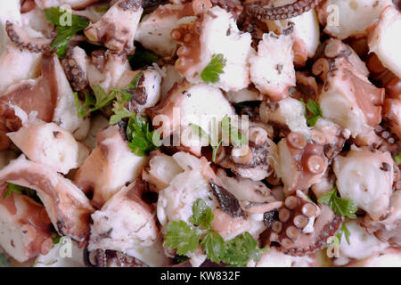 typical Neapolitan dish of the Christmas period called 'octopus salad' consisting of a boiled octopus, cut into small pieces and seasoned Stock Photo