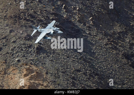 United States Marine Corps AV-8B Harrier II Jet Plane Flying Low And At High Speed Over The Mojave Desert In California, USA. Stock Photo