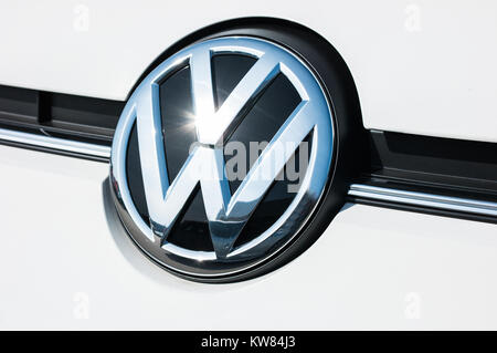 Volkswagen VW logo on a white car. Volkswagen is a famous European car manufacturer company based on Germany. Stock Photo