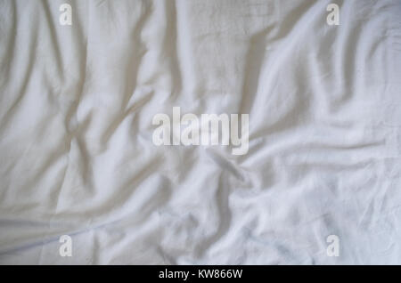 Texture of crumpled white sheet. Great concept of messy bedding. Stock Photo