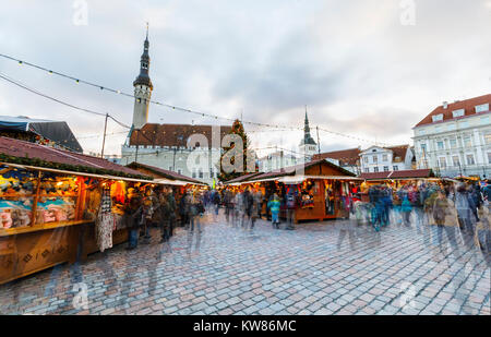 TALLINN, ESTONIA - DECEMBER 24, 2017: Tourists at Christmas market in Tallinn old town in Estonia on December 24, 2017 Stock Photo