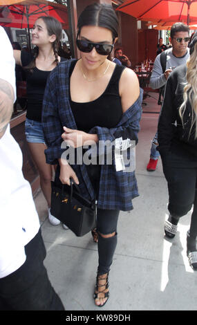 LOS ANGELES, CA - APRIL 26: Kim Kardashian, Rob Kardashian, and Fiancee Blac Chyna are seen heading for lunch on April 26, 2016 in Beverly Hills, California. .  People:  Kim Kardashian Stock Photo
