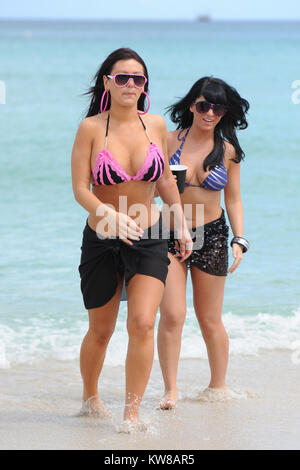 MIAMI, FL - Summer 2010: Angelina Pivarnick, Sammi Giancola on the set of Jersey Shore season 2 in Miami. Jersey Shore is an American reality television series that follows the lives of eight housemates Nicole 'Snooki' Polizzi, Jenni 'Jwoww' Farley, Mike 'The Situation' Sorrentino, Ronnie Ortiz-Magro, Vinny Guadagnino, Paul 'Pauly D' DelVecchio, Sammi 'Sweetheart' Giancola, and Angelina Pivarnick. The show debuted amid large amounts of controversy regarding the use of the words 'Guido/Guidette,' portrayals of Italian-American stereotypes.The series garnered record ratings for MTV, making it th Stock Photo