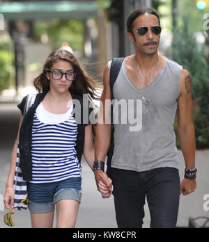 NEW YORK - JUNE 30:  Carlos Leon arrives at Madonna's Apt by bicycle to pick up their daughter Lourdes Maria Ciccone Leon (b. 14-Oct-1996 with Leon) just before husband Guy Richie is due to land in New York. Guy is eligibly flying in to town to talk to Madonna about saving their marriage. On June 30, 2008 in New York City  People:  Carlos Leon, Lourdes Maria Ciccone Leon Stock Photo
