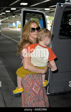 MIAMI, FL - JUNE 10: (EXCLUSIVE COVERAGE)  Actress Kelly Preston arrives with her son Benjamin Travolta at Miami International Airport on June 10, 2013 in Miami, Florida  People:  Kelly Preston Benjamin Travolta Stock Photo