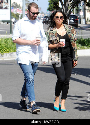 LOS ANGELES, CA - APRIL 25: Singer Sam Smith gets coffee with an unidentified woman. Samuel Frederick 'Sam' Smith is an English singer-songwriter. He rose to fame in October 2012 when he was featured on Disclosure's breakthrough single 'Latch', which peaked at number eleven on the UK Singles Chart on April 25, 2016 in west Hollywood, California  People:  Sam Smith Stock Photo
