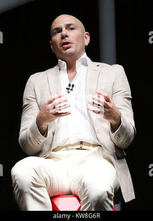 MIAMI BEACH, FL - APRIL 19: Pitbull speaks at Emerge Americas at the Miami Beach Convention Center on April 19, 2016 in Miami Beach, Florida.   People:  Pitbull Stock Photo