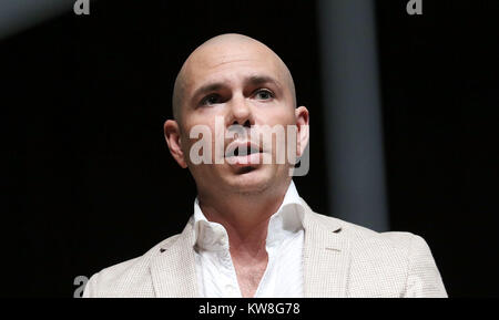 MIAMI BEACH, FL - APRIL 19: Pitbull speaks at Emerge Americas at the Miami Beach Convention Center on April 19, 2016 in Miami Beach, Florida.   People:  Pitbull Stock Photo