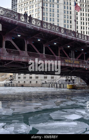 Shoppers walk on the Michigan Avenue in downtown Chicago, Sunday, Dec ...