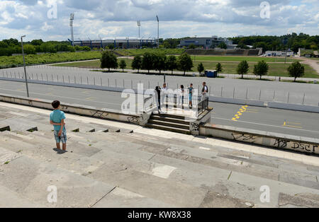Oranienberg, BRANDENBURG, GER. 22nd July, 2012. 20120722 - Visitors stand on the former speaker rostrum at the base of the Zeppelin Grandstand in Nuremberg, Germany. From here during the 1930s, Nazi officials, including dictator Adolf Hitler, addressed Nazi Party rallies. Credit: Chuck Myers/ZUMA Wire/Alamy Live News Stock Photo