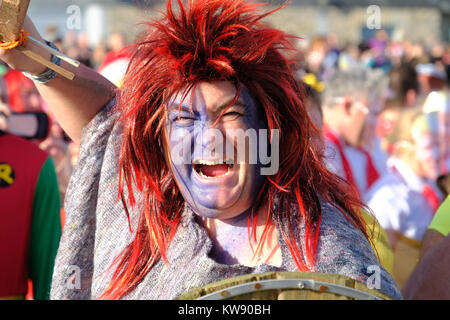 Lyme Regis, Dorset, UK. 1st Jan, 2018. Hundreds turned out in fancy dress for the traditional New Year day 'Lyme Lunge' race into the sea. The annual event was watched by over a thousand spectators who gathered on Lyme Regis Cobb Beach to support the event. Credit: Tom Corban/Alamy Live News Stock Photo