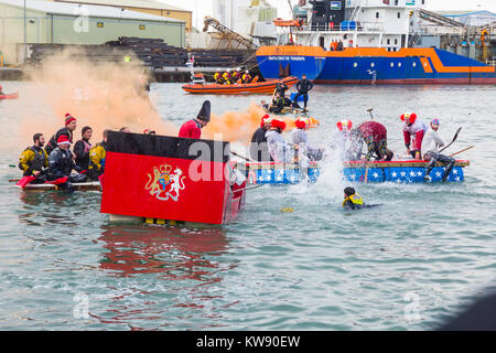 Poole, Dorset, UK. 1st Jan, 2018. The New Years Day Bath Tub Race takes place following a backlash in social media that the event would have to be cancelled due to Health & Safety concerns. Hundreds turn out to watch the event despite the wet weather, as a variety of unusual craft take to the water to race, with participants having fun throwing eggs and flour, firing water cannons and capsizing competing craft. Credit: Carolyn Jenkins/Alamy Live News Stock Photo